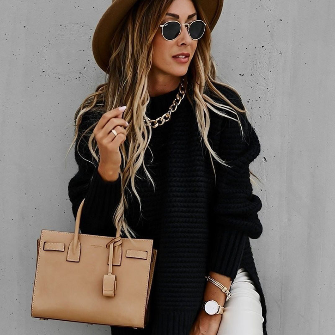 Long knitted sweater with openings