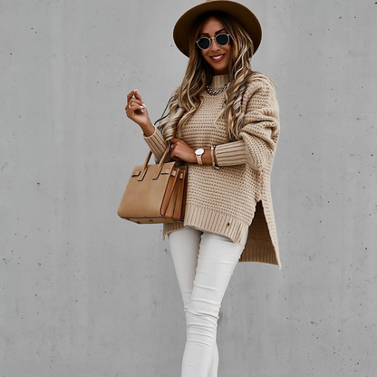 Long knitted sweater with openings